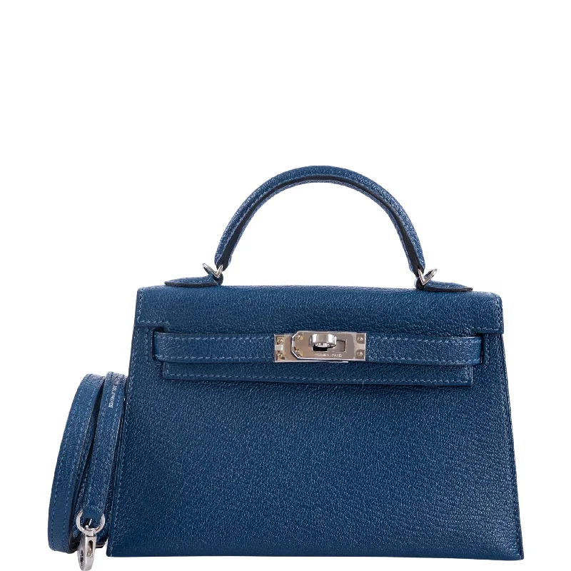 Hermès Kelly Bags in a metallic silver for a glamorous touchHermès Kelly 20 Mini II Sellier Verso Blue Deep and Ebène Chèvre Palladium Hardware