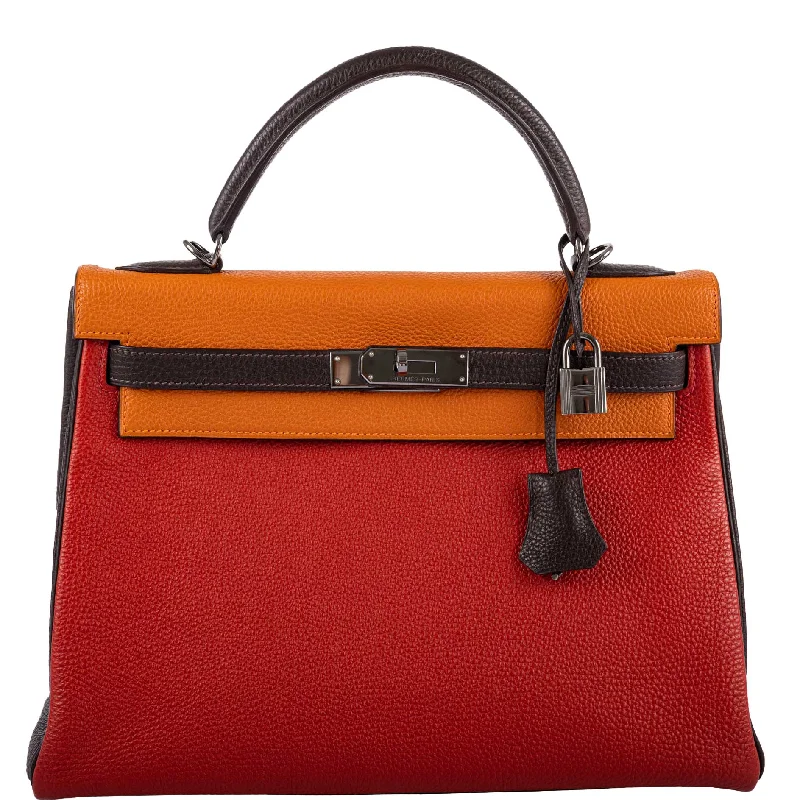 Hermès Kelly Bags with a zip - top closure for added securityHermès Kelly 32 Retourne Orange H, Rouge Vif & Ebene Togo with Ruthenium Hardware - 2006, J Square