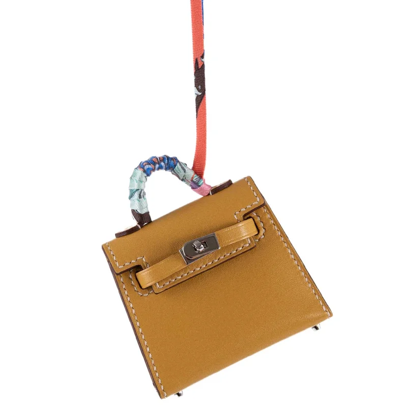 Hermès Kelly Bags with a detachable shoulder strap for versatilityHermès Micro Kelly Twilly Charm Foine Tadelakt Leather Palladium Hardware - 2020, Y