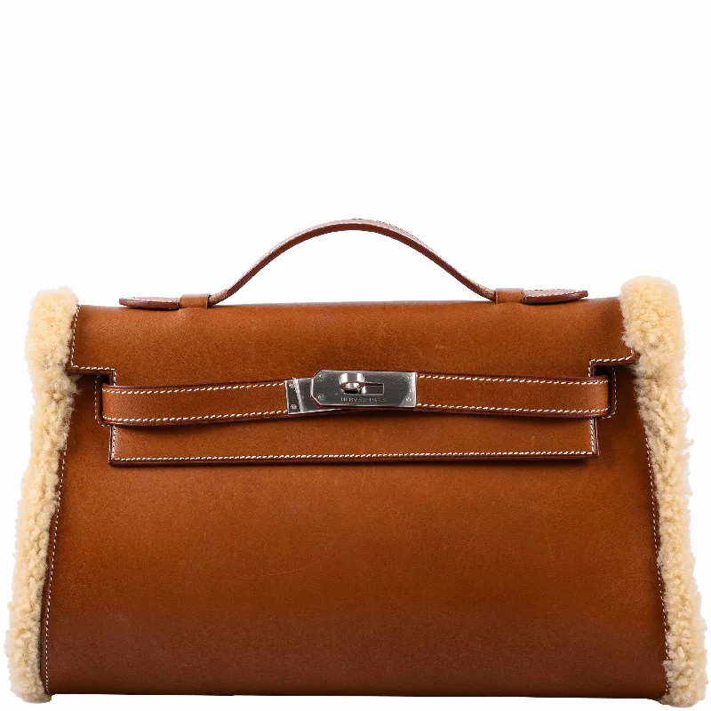 Hermès Kelly Bags with a double - handle option for easy carryingHermès Teddy Kelly Clutch Barenia Leather & Mouton Shearling Palladium Hardware